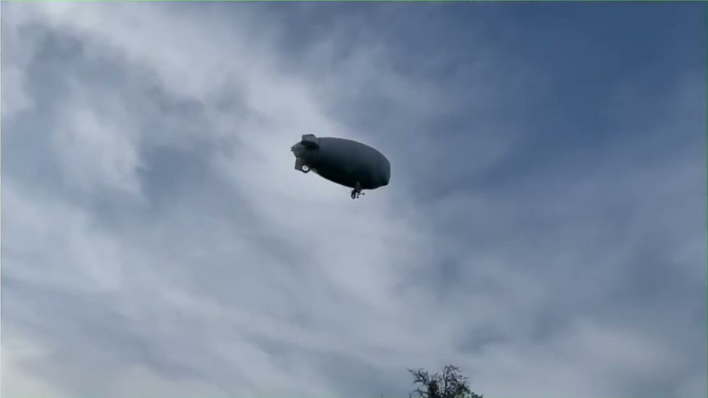 The real research airship in flight during an outdoor experiment