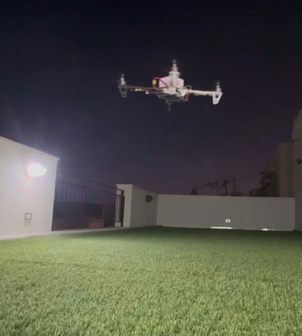 The quadcopter hovering during a night test flight