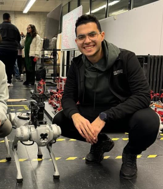 Mostafa with the Unitree Go1 quadruped in the IAS lab at the University of Stuttgart